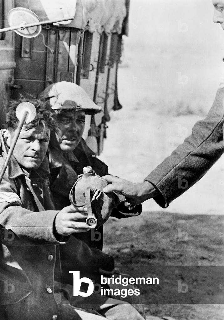 British prisoners of war get their water ration, 1942 (b/w photo)