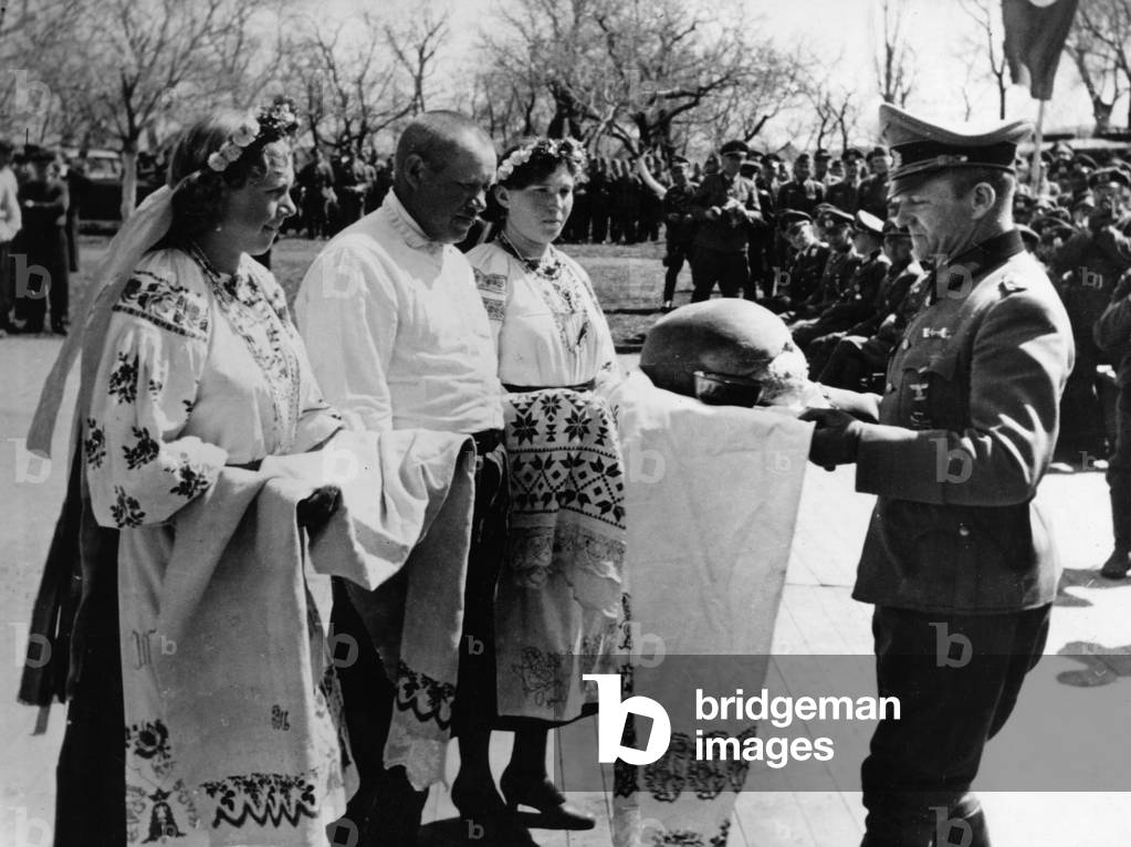 Villagers welcome German soldiers, 1942 (b/w photo)