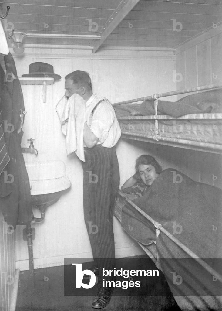 Man and woman in the cabin of a vacation boat, 1924