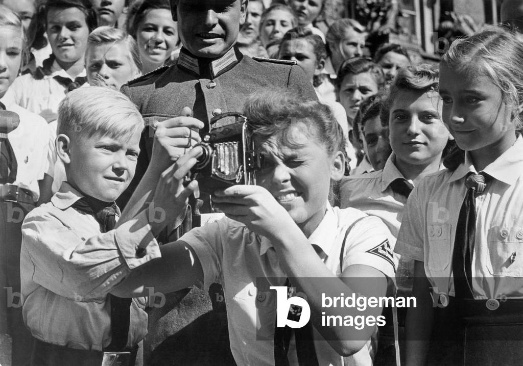 BDM girl with a camera (b/w photo)