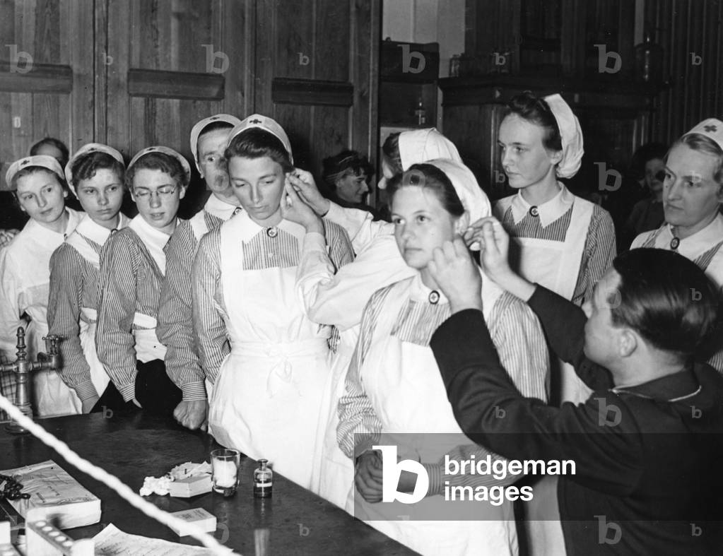 WW2: Red Cross nurses during a blood test, 1940 (b/w photo)