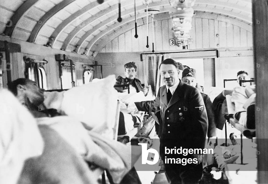 Adolf Hitler during a visit of a transporter for the wounded, 1939 (b/w photo)