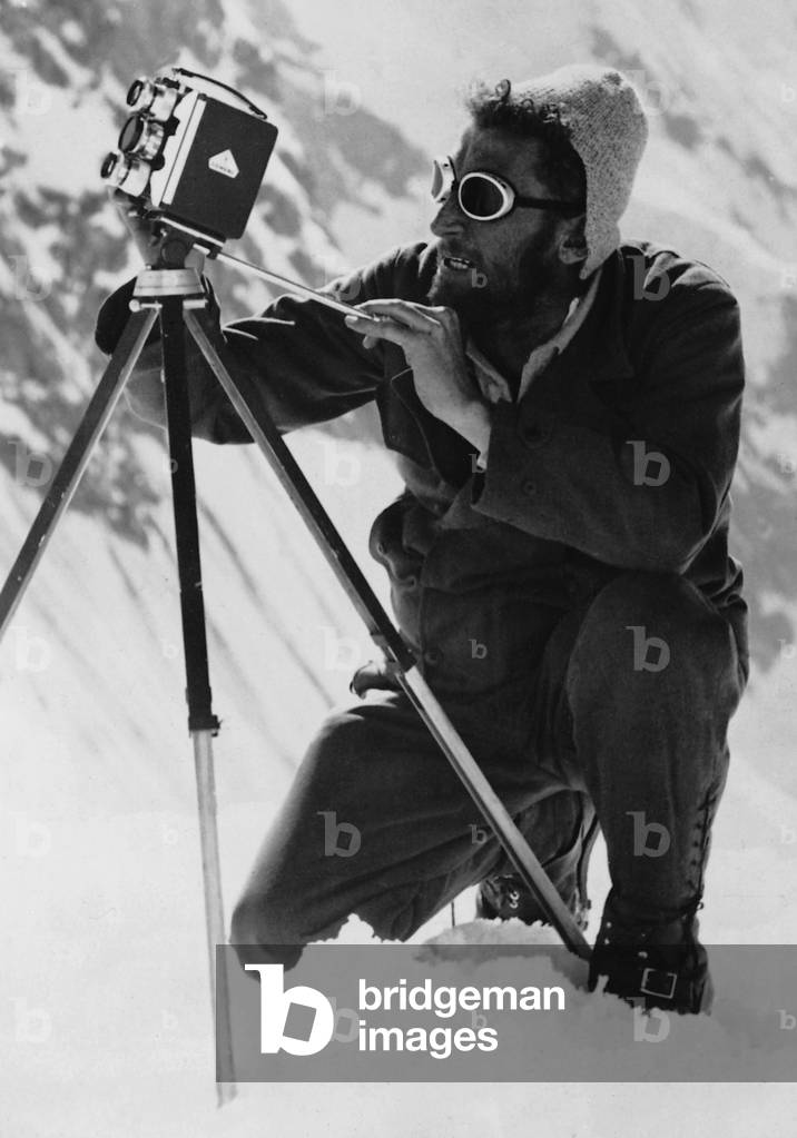 Climber with film camera (b/w photo)