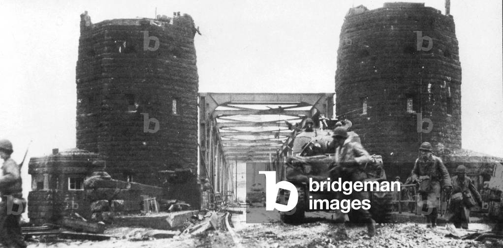 Americans crossing the Ludendorff Bridge across the Rhine at Remagen (b/w photo)
