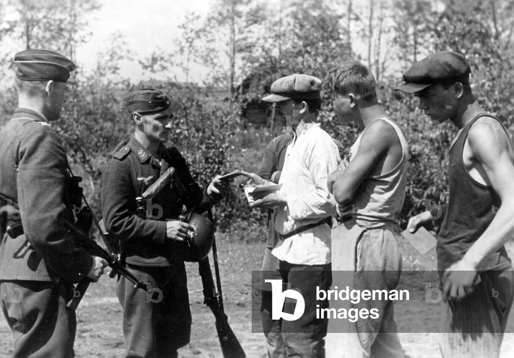ID control in a partisan village, 1942 (b/w photo)