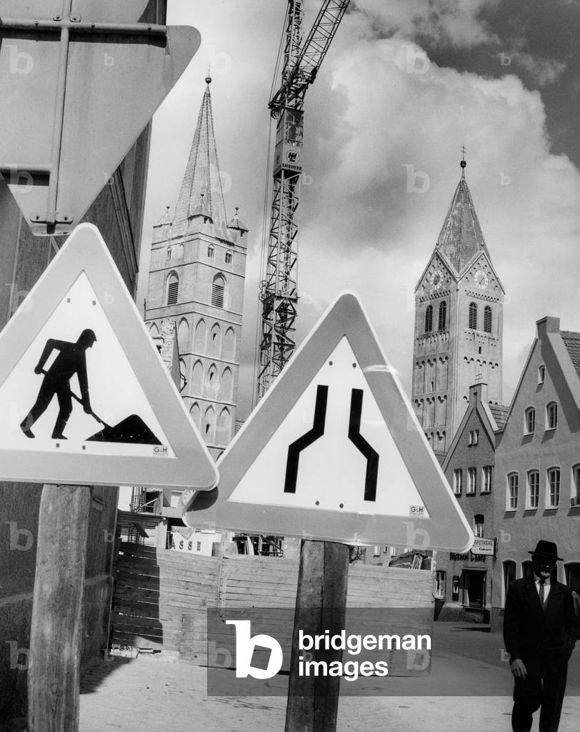 Signs on a building site (b/w photo)