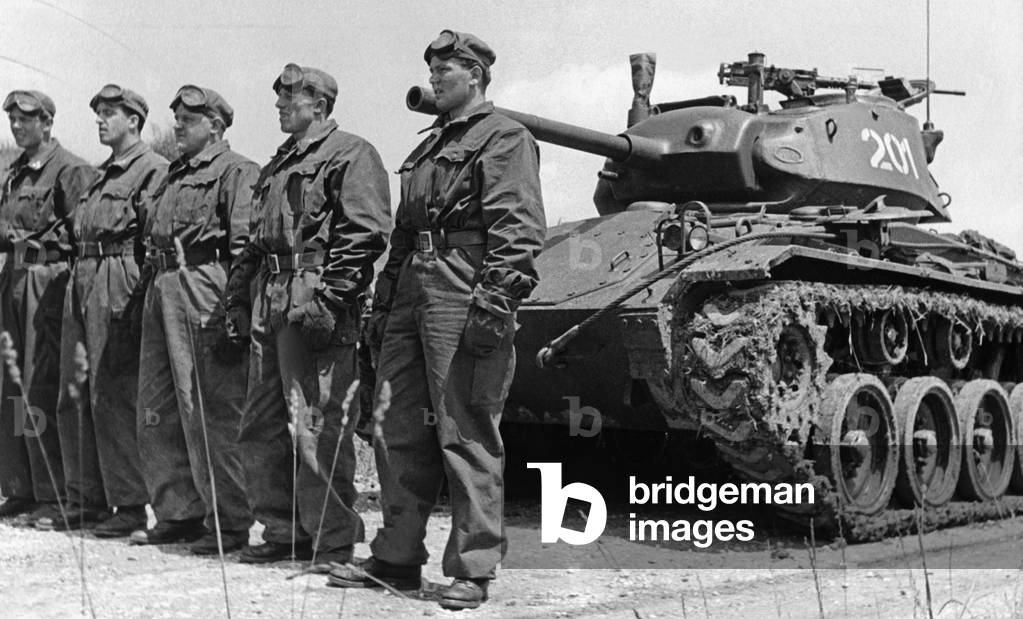 Austrian soldiers in front of a tank, 1950s. (b/w photo)