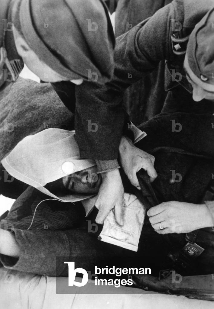 Collection point for wounded soldiers, 1943 (b/w photo)