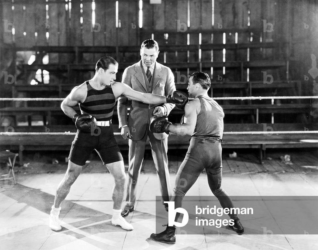 Rudolph Valentino at a boxing lesson (b/w photo)