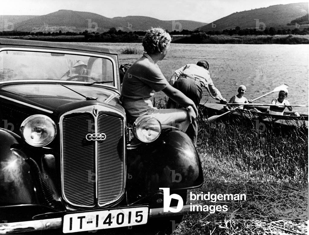 Weekend gateway with car and folding kayak, 1936 (b/w photo)
