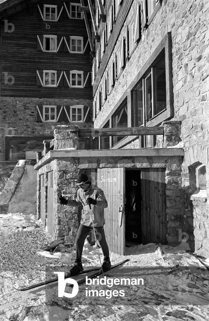Skier with equipment at the Weissseehaus, 1962 (b/w photo)