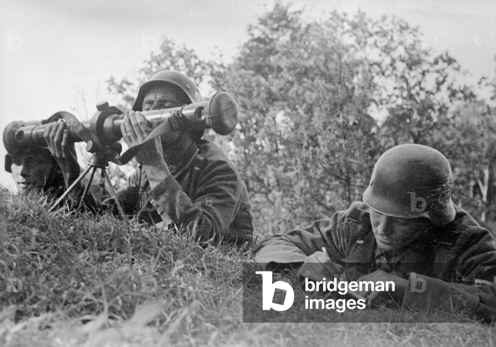 German soldiers survey Russian positions, 1941 (b/w photo)