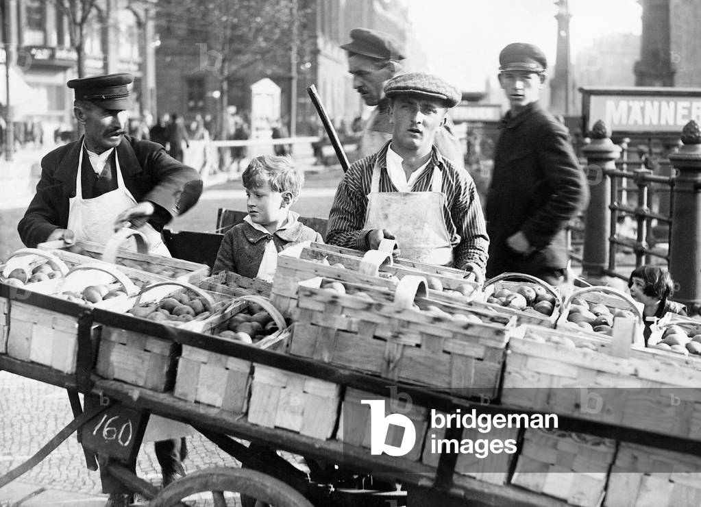 Selling apples at the fruit market, 1927 (b/w photo)