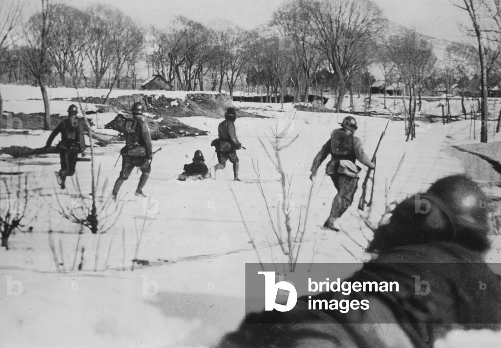 Japanese troops attack Chinese positions, 1942 (b/w photo)