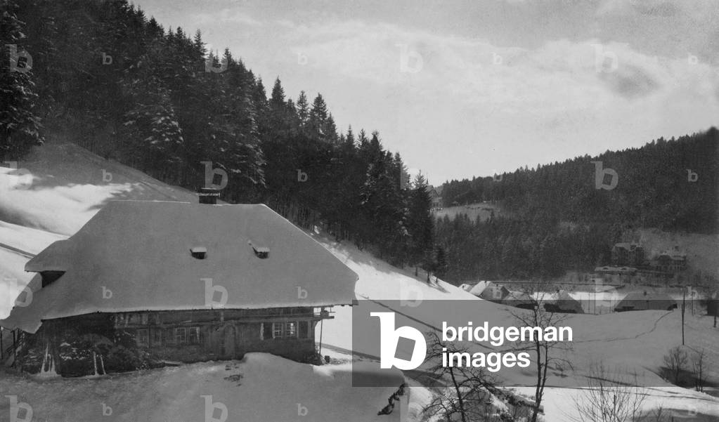Black Forest house in snow (b/w photo)