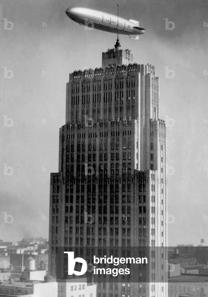 The airship 'Macon' above a high-rise in San Francisco, 1933 (b/w photo)