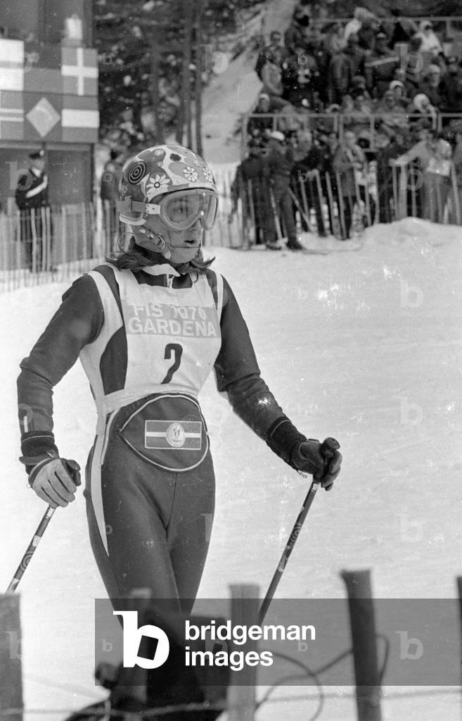 Ski female athlete in the finish area of ??a piste, 1970 (b/w photo)