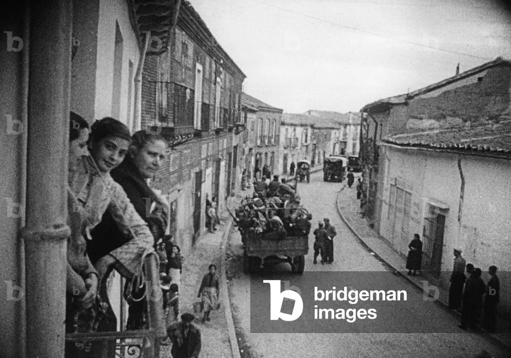 Troops marching through a Spanish village, 1936