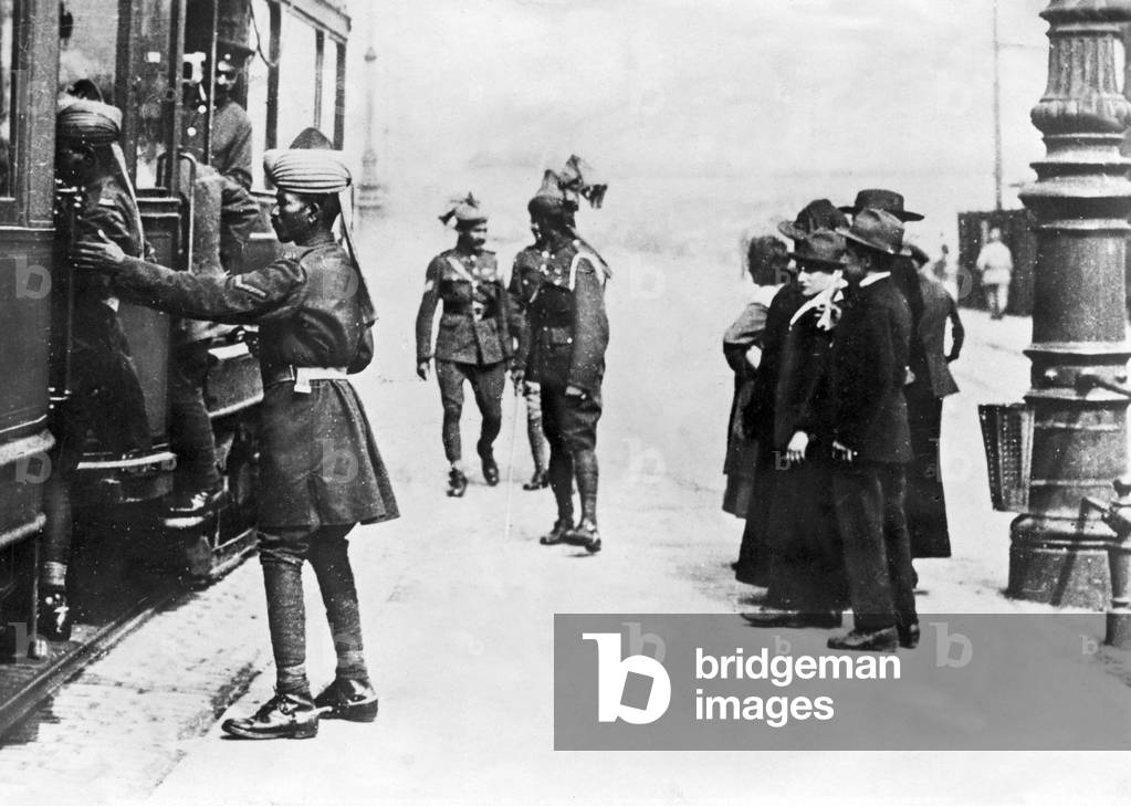 Indian soldiers climb on a tram in Cologne, around the 1920s