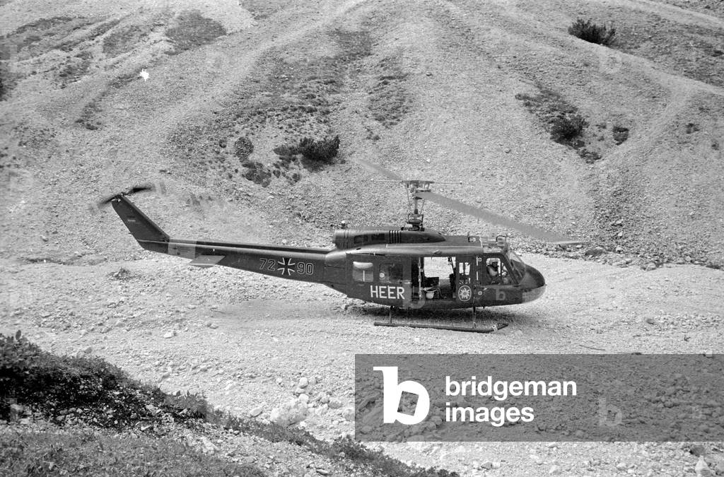 Rescue helicopter of the type Bell UH-1D in action, 1970 (b/w photo)