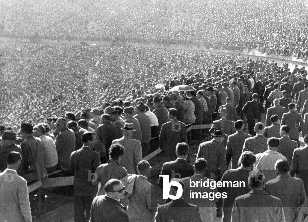 Crowd in a soccer stadium (b/w photo)