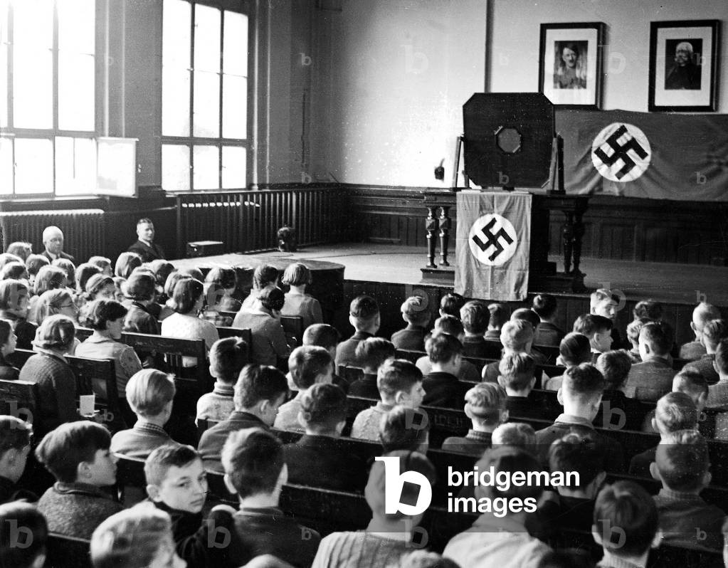 Community reception of a radio program in a school, 1939 (b/w photo)