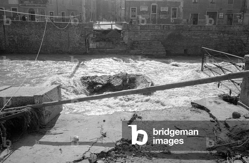 Destroyed bridge after a storm in Italy, 1960s (b/w photo)
