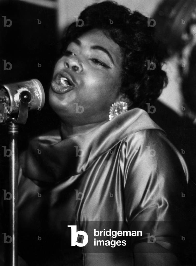 A singer in a jazz club in Paris, 1960 (b/w photo)