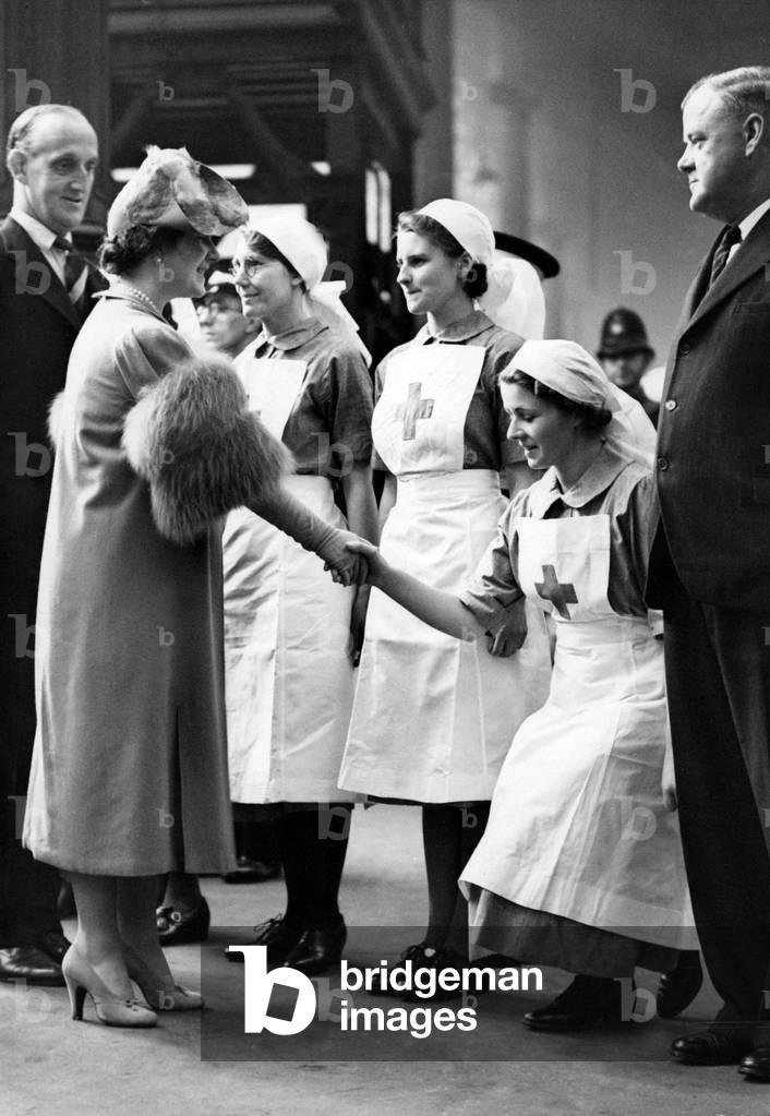 Queen Elizabeth visits a casualty evacuation train in London, 1939 (b/w photo)