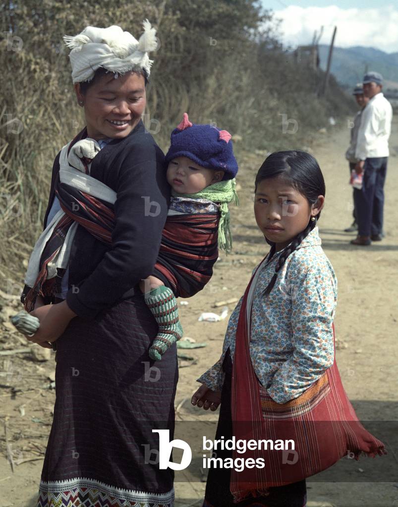 Women and children from the tribe of Meo (Hmong also) on a road near the so-called 'Plain of Jars' in Xieng Khouang province in Laos, 1977 (photo)