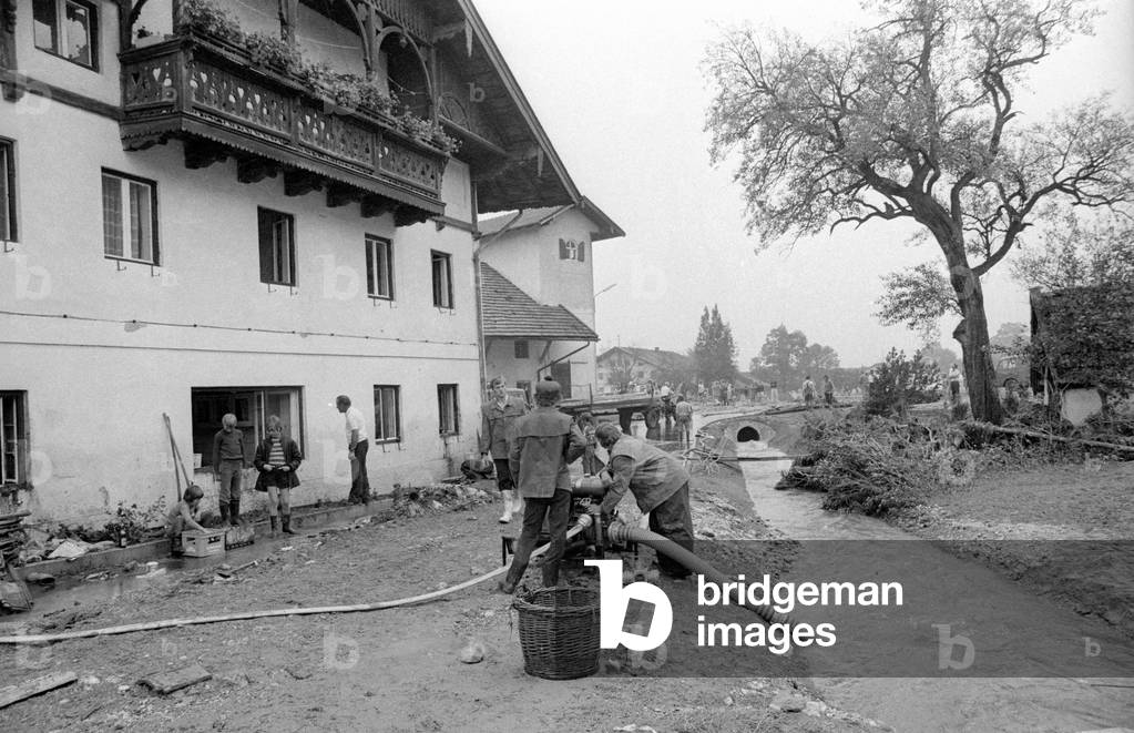 Cleaning up after a storm at Lake Chiemsee, 1974 (b/w photo)