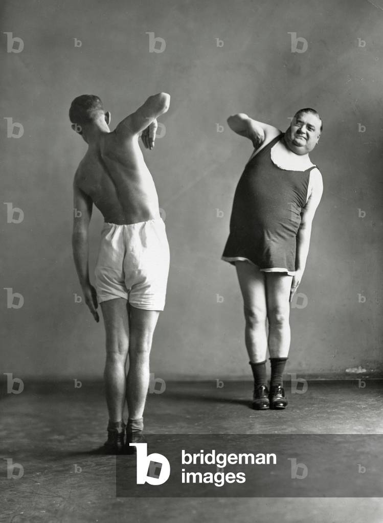 Two men doing their gymnastic exercises, 1936 (b/w photo)