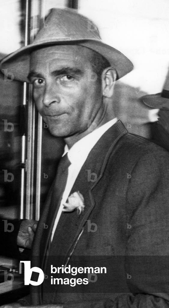 Mountaineer Hias Rebitsch arriving in Munich, 1954 (b/w photo)