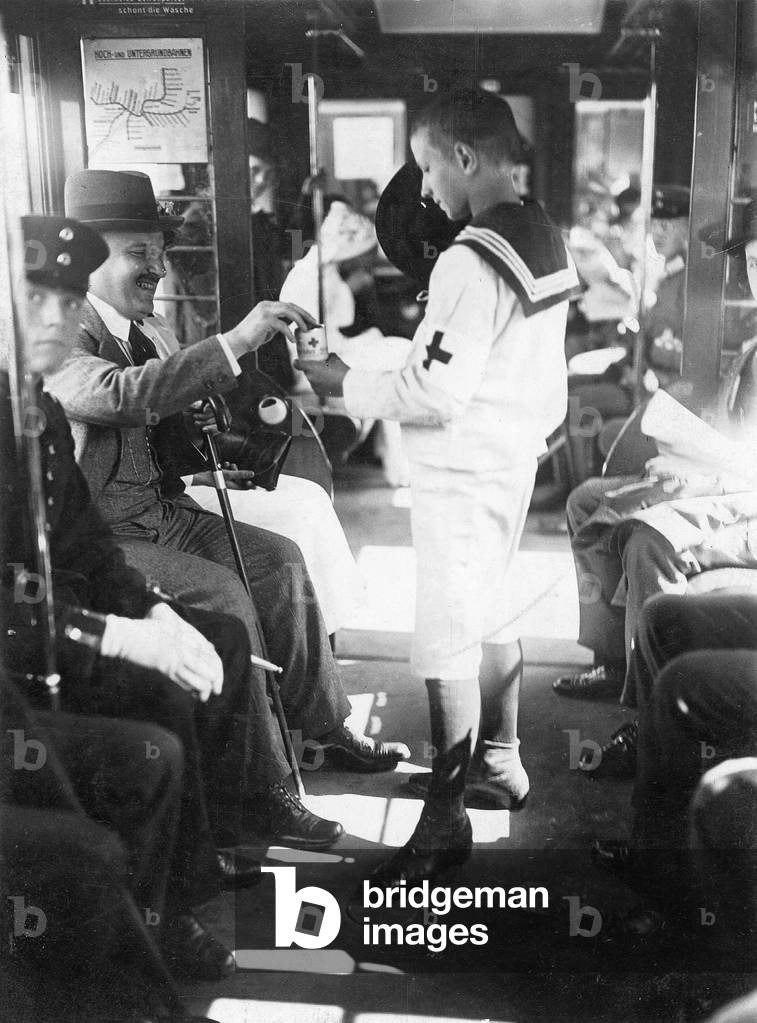 Boy collects for the German Red Cross, 1914 (b/w photo)