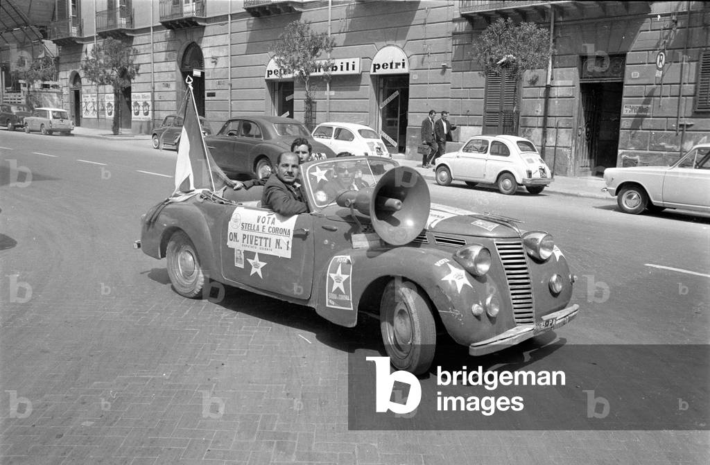 Mobile election advertising on a street in Palermo, 1963 (b/w photo)