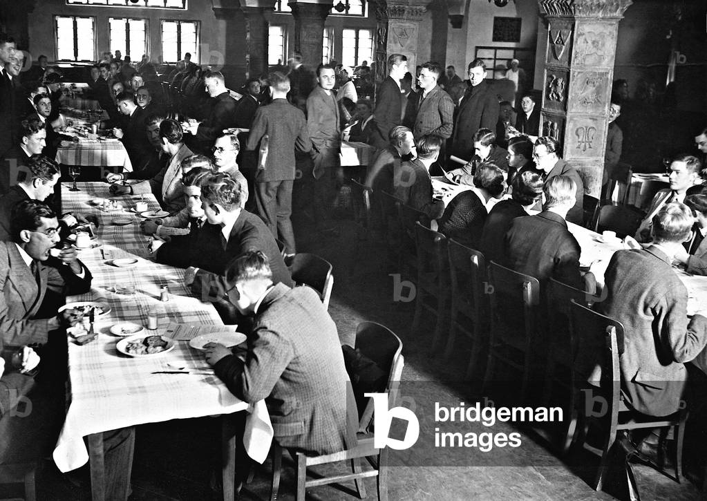 Students eat in the cafeteria, 1930 (b/w photo)