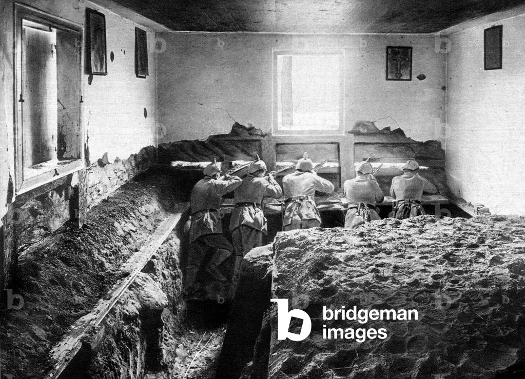 German soldiers defending fortified position on the Vistula : a rifle pit trench was digged in a farm house, 1915