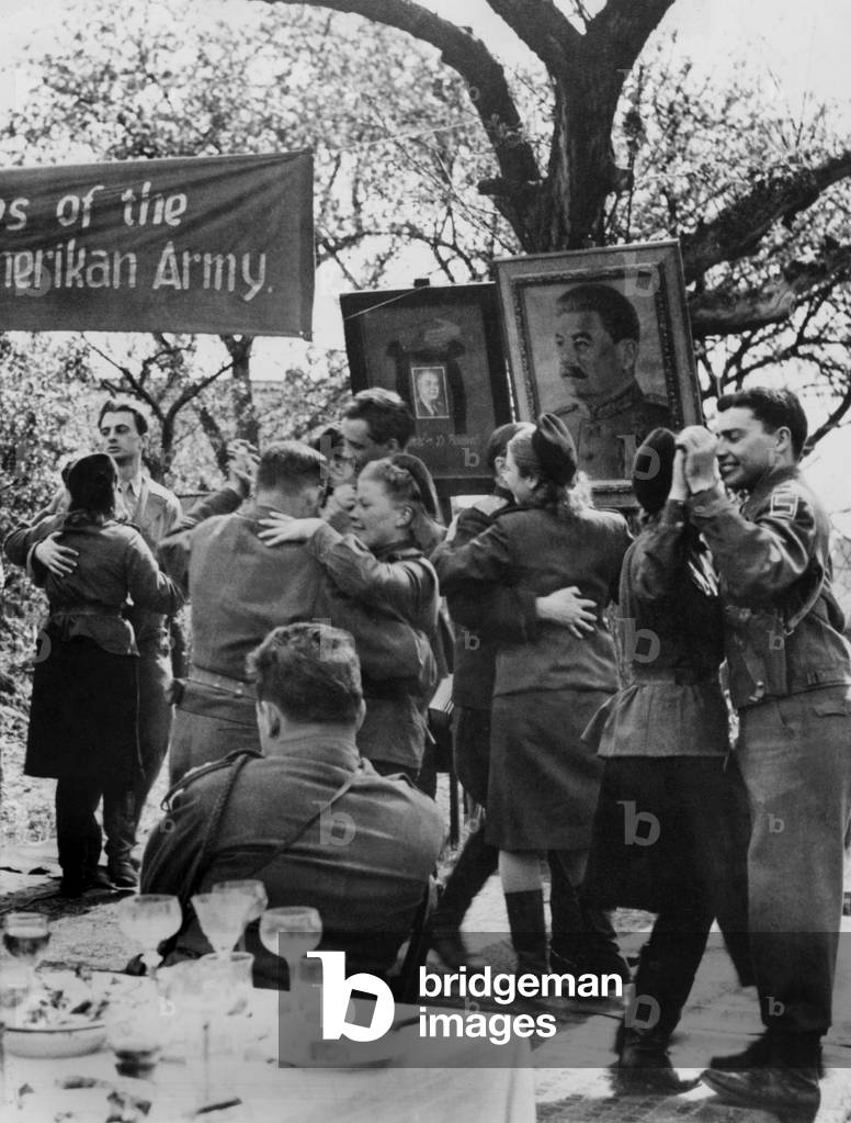 Ball in Torgau, german town on Elba, where russian and american army joined on april 25, 1945 : we can see portraits of Rosevelt and Staline