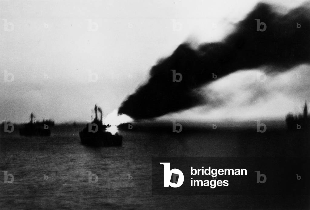 Japanese kamikaze plane attacking an american battleship off Riou-Kiou island (Okinawa battle) 1945