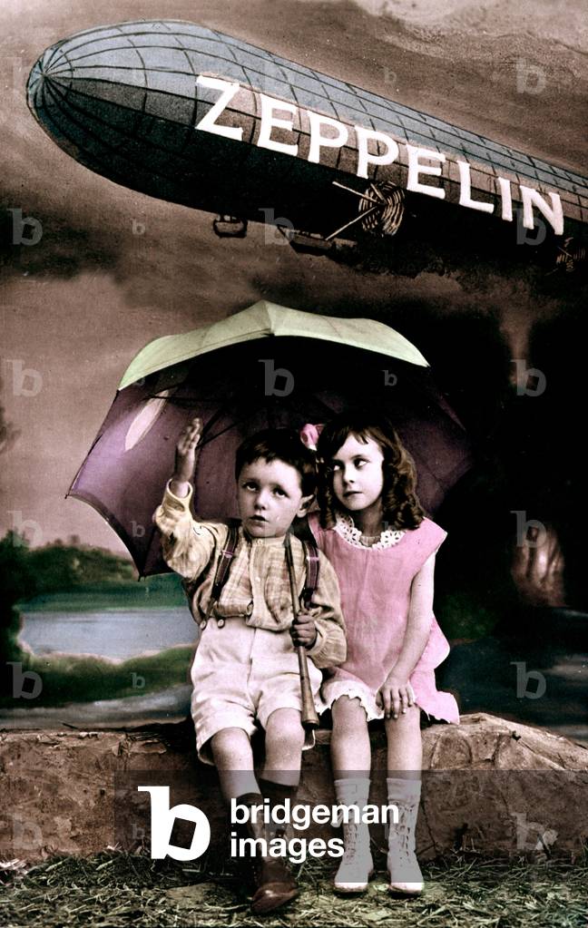 Children protecting themselves with an umbrella from a bombing by a german zeppelin, ww1, postcard