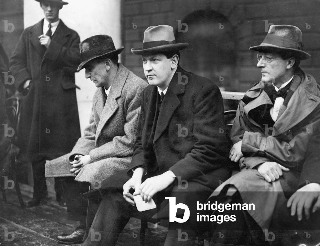 Irish politician and Sinn Fein leader Michael Collins (centre) and Gearoid O'Sullivan (right) at the ceremony to launch the Irish Free State at College Green, Dublin, March 1922 (b/w photo)