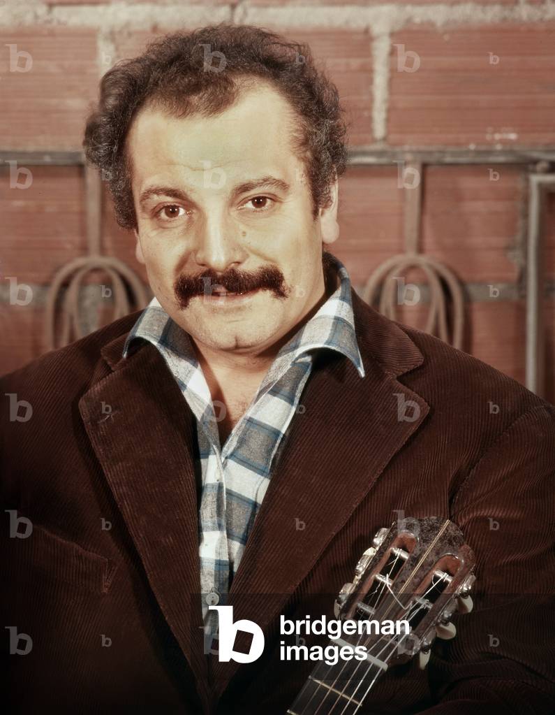 French singer Georges Brassens (1921-1981) playing the guitar c. 1961