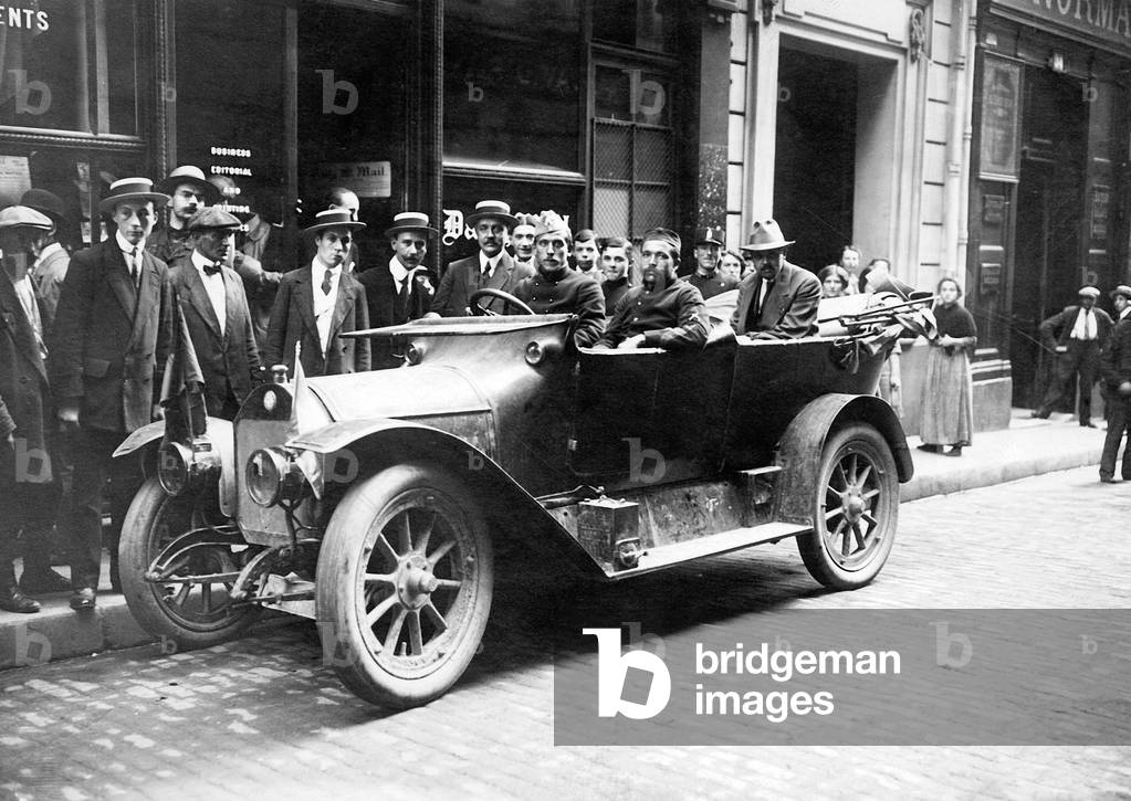 First german car seized by the Belgians who drove it to Paris here in the Sentier street during the great war