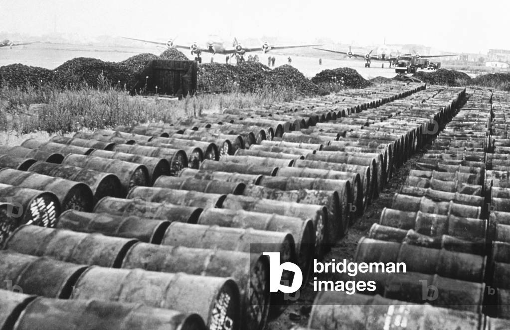 Oil and coal barrel ready for provision of fresh supplies to Berlin at Tempelhof airport, 1948 (b/w photo)