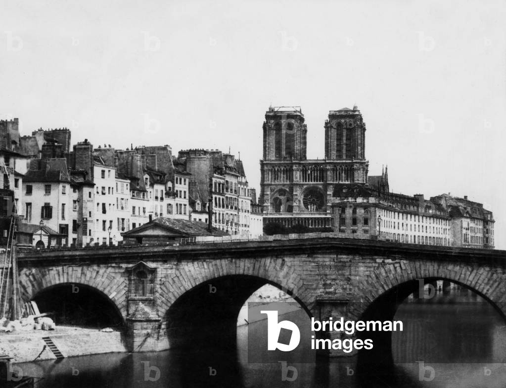 View of former bridge Saint Michel and in the background Notre Dame cathedral in Paris