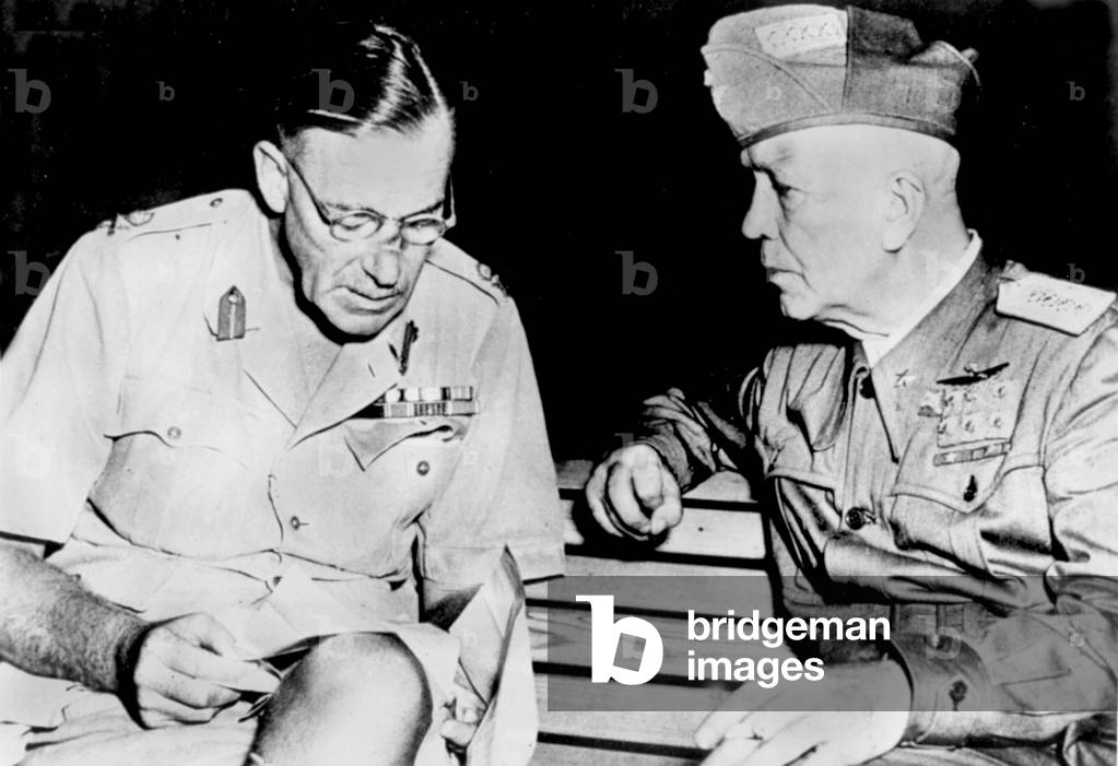 on the right, Marshal Pietro Badoglio italian prime minister , confers with lieutenant General Frank Noel Mason MacFarlane of the British army and Governer-Commander of Gibraltar here in september 1943 somewhere in southern Italy, preparing the Sicily landings by the Allied