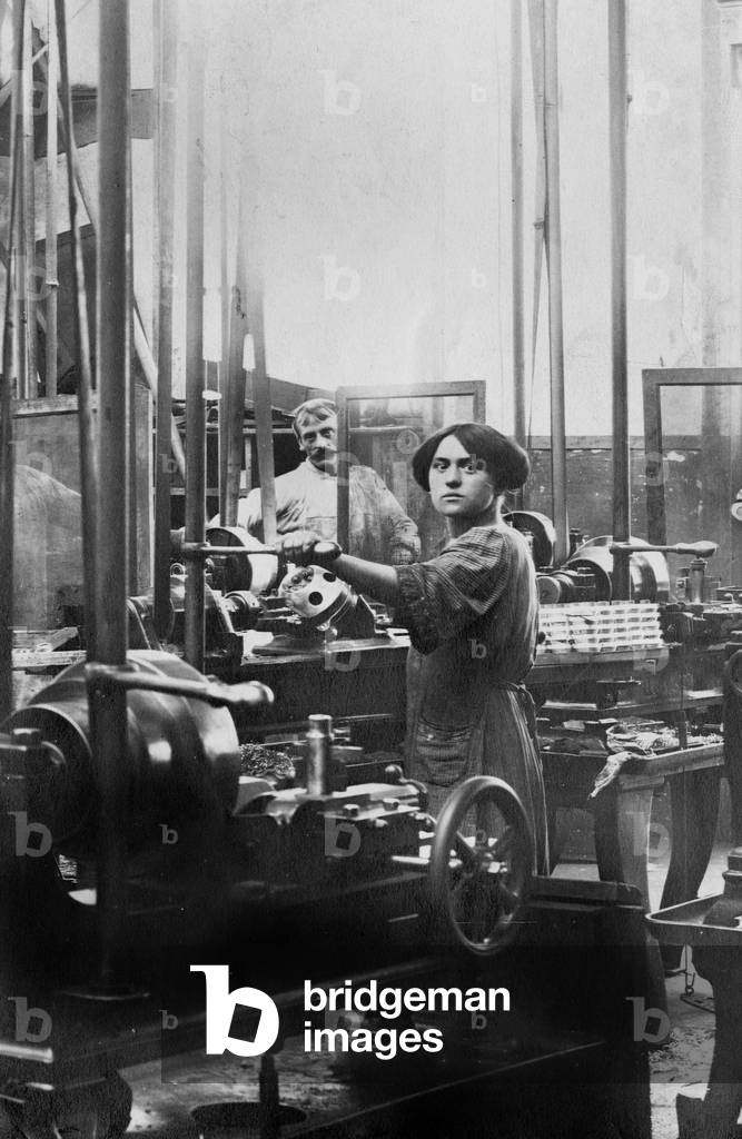 Woman working at the Schneider factory near Honfleur, Normandy, France : making of the rockets, during the great war