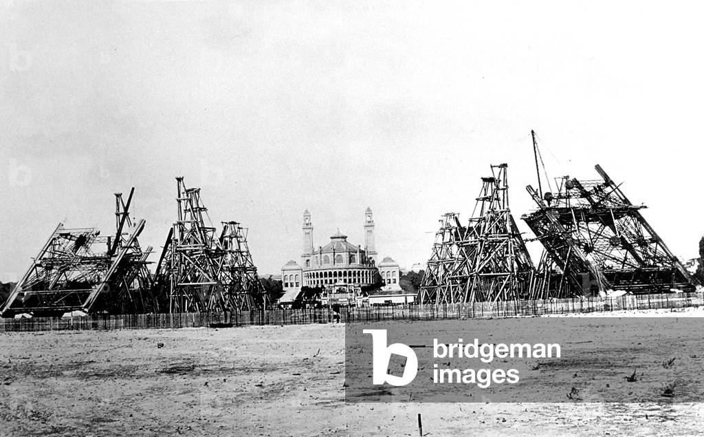 The four pillars of the Eiffel Tower built for the 1889 World Exhibition in Paris, here in 1887: state of assembly of the crossbaletriers of the west pillar to 18 July 1887 (The construction began on 28 January 1887) - building of the Eiffel Tower for world fair in Paris in 1889, here on july 18, 1887