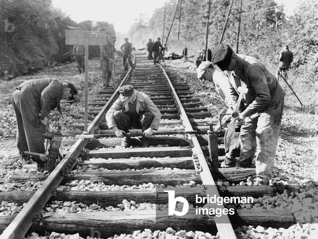 French workers repairing railways detsroyed by Germans during their retreat, 1944