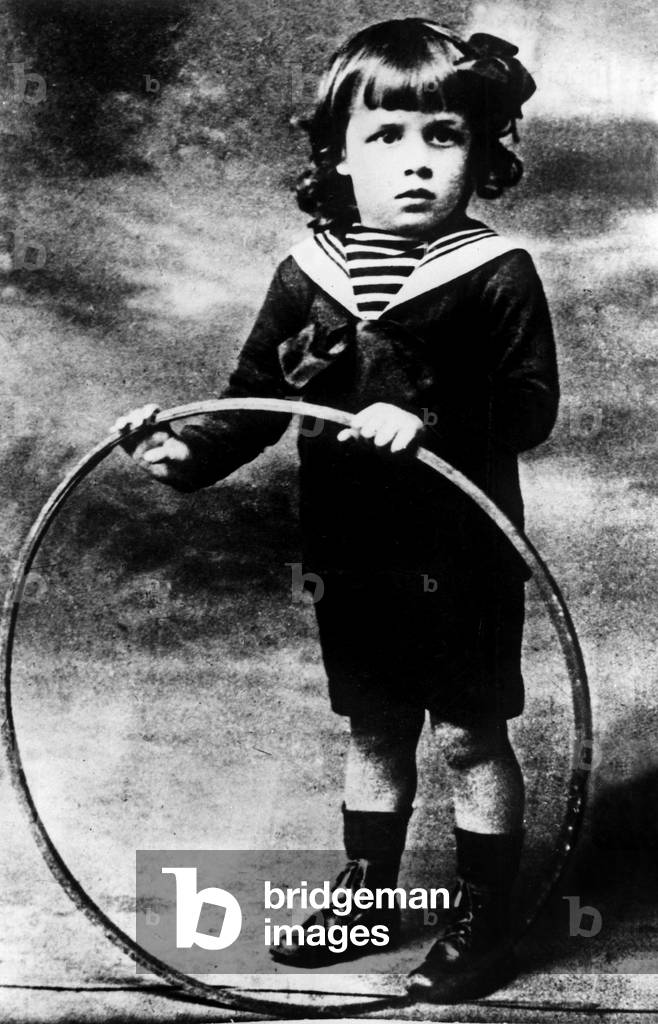 French writer Albert Camus (1913-1960) here as a child c. 1916 playing with a hoop